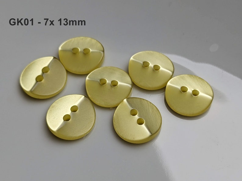 small, yellow plastic buttons to choose from 10 mm to 13 mm GK01 - 7x 13mm