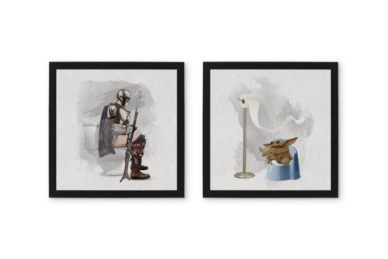 May include: Two framed watercolor illustrations. The first shows a Mandalorian character sitting on a toilet with a rifle. The second shows a Baby Yoda character sitting on a potty with a roll of toilet paper.