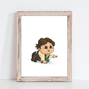 May include: A framed print featuring a cartoon illustration of a baby crawling. The baby has brown hair, a tan shirt, and a dark vest. The artwork is in a wooden frame and is set against a white background.