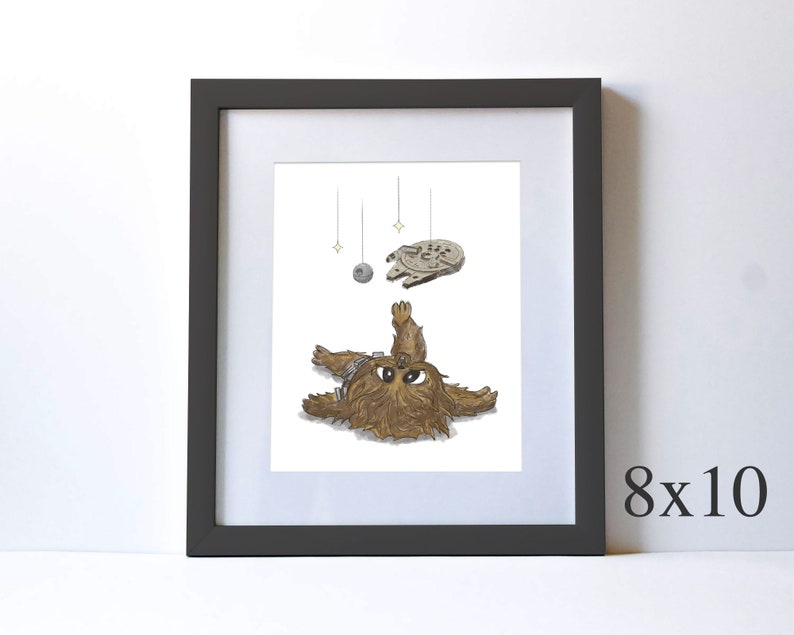 May include: A framed illustration of a brown and white Wookiee character from Star Wars lying on its back with its arms and legs outstretched. The character is looking up at a small, gray spaceship hanging from the ceiling. The spaceship is surrounded by three small, yellow stars.