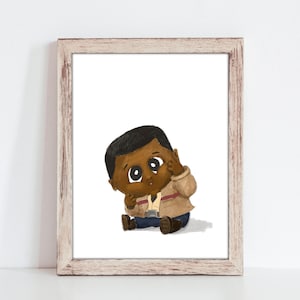 May include: A framed art print featuring a cartoon illustration of a baby with dark skin. The baby is wearing a tan jacket, blue pants, and brown shoes. The baby is sitting down and touching their face. The frame is light brown.