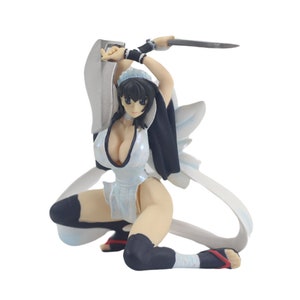 May include: A white and black anime figurine of a woman in a white and silver outfit holding a sword. She is kneeling with her legs crossed and her arms raised.