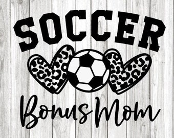 May include: Black and white graphic design with the text "Soccer Bonus Mom" and a soccer ball in the center. Two leopard print hearts are on either side of the soccer ball.