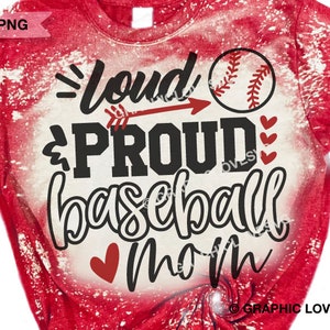 May include: Red and white bleached t-shirt with a baseball graphic and the text "Loud & Proud Baseball Mom" in black.
