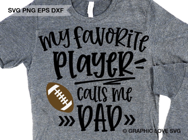 May include: A gray t-shirt with black text that reads "My favorite player calls me DAD" with a brown football graphic. The text is surrounded by arrows pointing inwards.