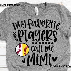 May include: Gray t-shirt with black text that reads "My favorite players call me Mimi" with a black softball graphic and two black hearts.  The text "GRAPHIC LOVE SVG" is in the bottom right corner.