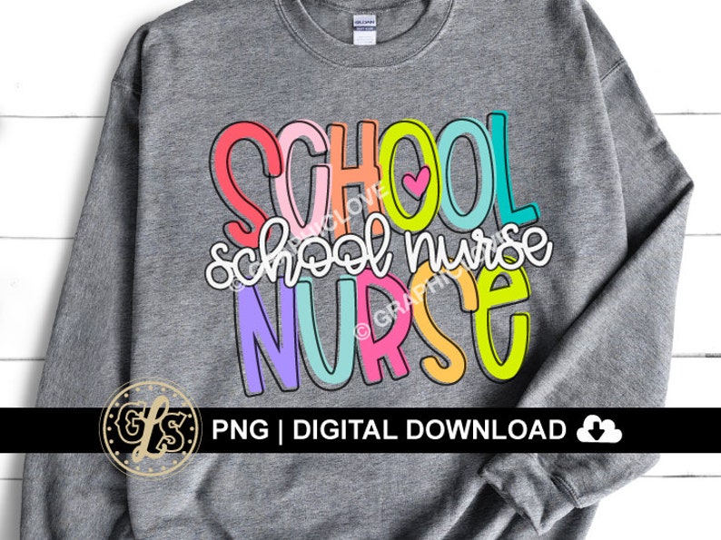 May include: A gray sweatshirt with the text "SCHOOL school nurse NURSE" in colorful letters. The letters are outlined in black and have a rainbow color scheme. A small pink heart is included in the text.