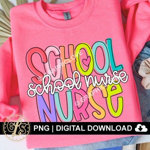 May include: Pink sweatshirt with the text "SCHOOL NURSE" in colorful, outlined letters. The letters are layered on top of each other and have a playful, cartoon-like style.