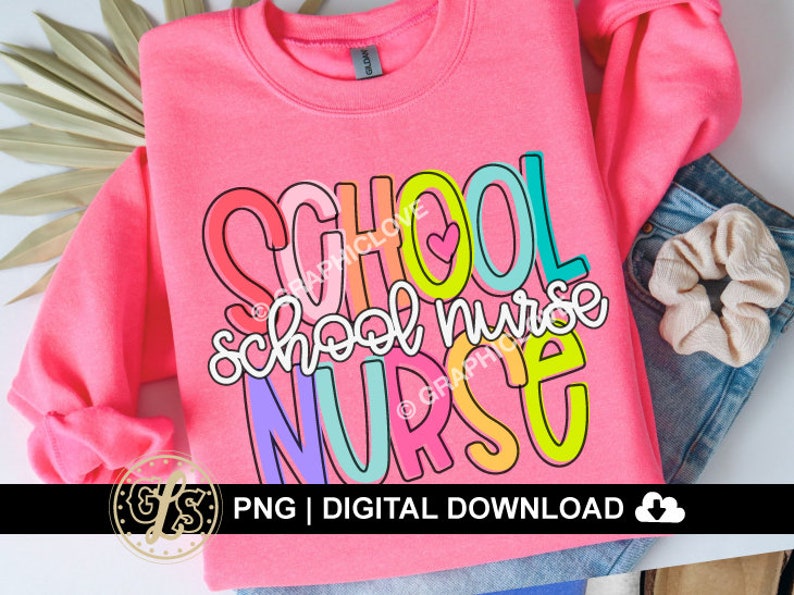 May include: Pink sweatshirt with the text "SCHOOL NURSE" in colorful, outlined letters. The letters are layered on top of each other and have a playful, cartoon-like style.