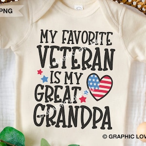 May include: A white onesie with the text "My favorite veteran is my great grandpa" in black. A red, white, and blue heart with stars is next to the text.
