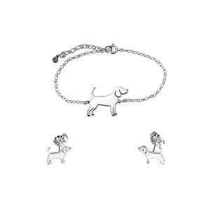 May include: A silver bracelet with a dog silhouette charm and a pair of matching silver dog stud earrings.