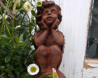 Angel Putto on Ball Iron Rust Relaxed