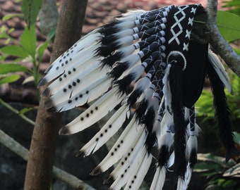 Short White Indian Headdress Replica made with white swan feathers painted with spray