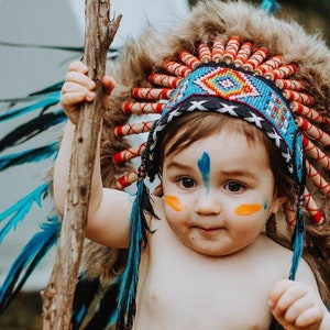 Short Orange Indian Headdress Replica made with Orange swan feathers and fabric band on the front