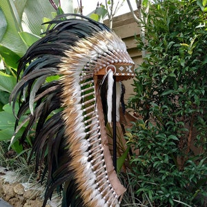 Long Brown Indian Headdress Replica made with real rooster feathers and brown and white fur and gold beaded work in the front image 1