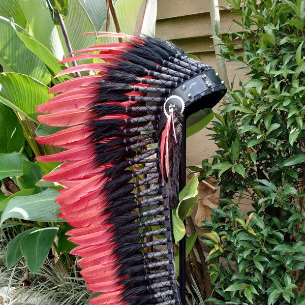 Long Indian Headdress Replica made with red swan feathers  and leather and metal work in the front