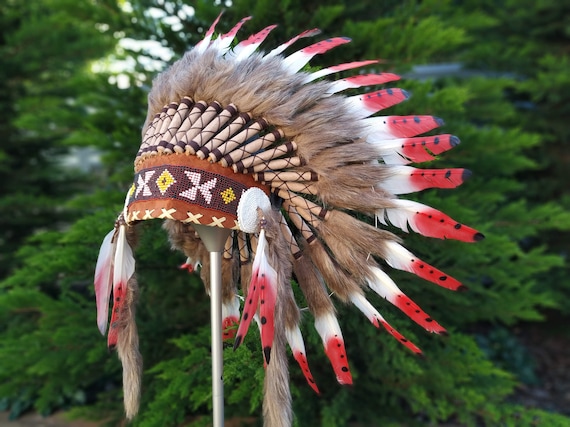 Short Orange Indian Headdress Replica made with Orange swan feathers and fabric band on the front