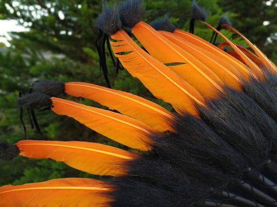 Short Orange Indian Headdress Replica made with Orange swan feathers and fabric band on the front