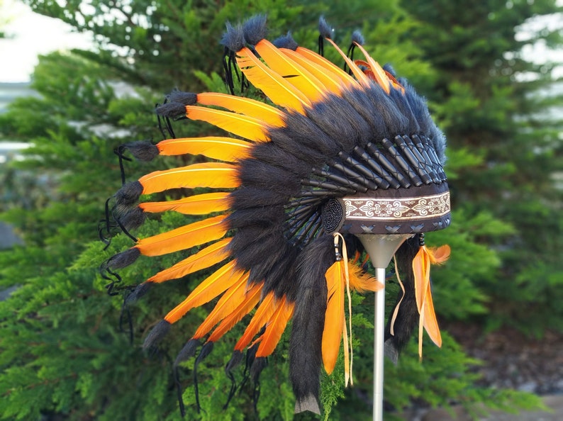 Short Orange Indian Headdress Replica made with Orange swan feathers and fabric band on the front