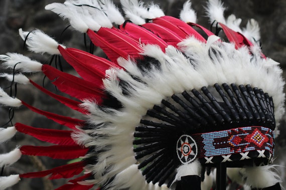 Short Orange Indian Headdress Replica made with Orange swan feathers and fabric band on the front