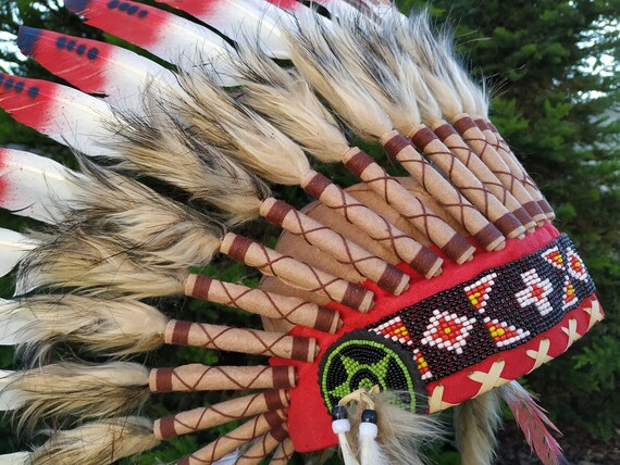 Short Orange Indian Headdress Replica made with Orange swan feathers and fabric band on the front
