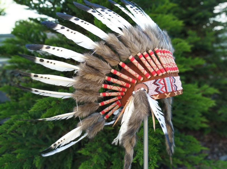 Short Indian Headdress Replica made with Black painted White Swan feathers with white beadwork in the front