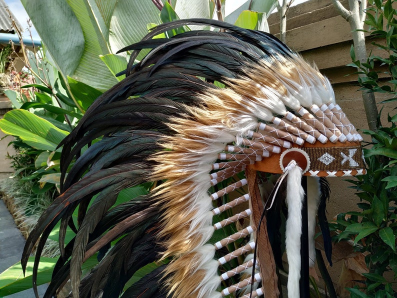 Long Brown Indian Headdress Replica made with real rooster feathers and brown and white fur and gold beaded work in the front image 3