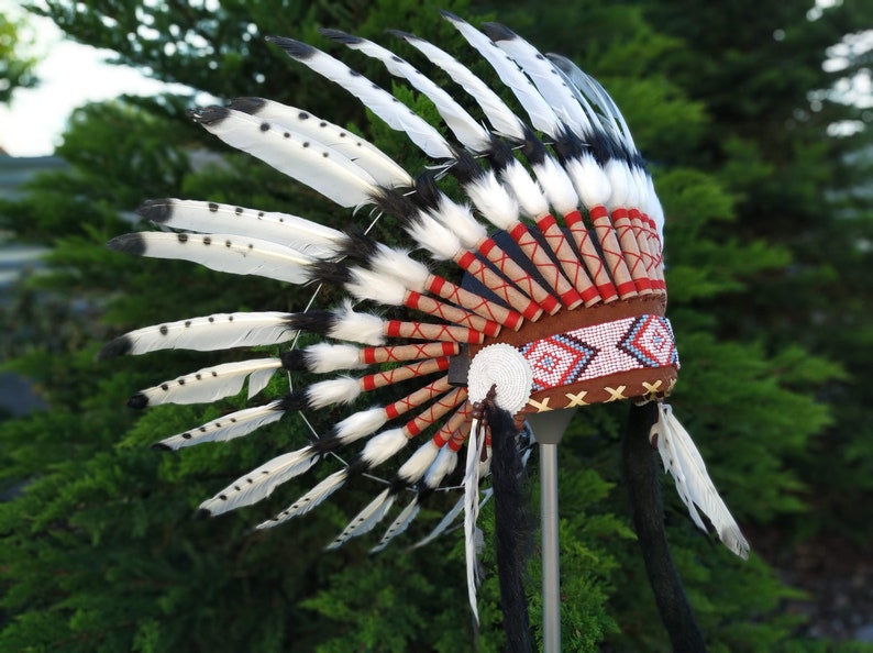 Short Indian Headdress Replica made with Black painted White Swan feathers with white beadwork in the front