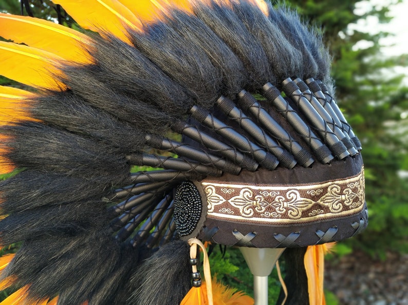 Short Orange Indian Headdress Replica made with Orange swan feathers and fabric band on the front