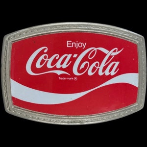 Anuncio de Coca-Cola, refresco, refresco, hippie, hebilla de cinturón vintage de los años 70, cartel publicitario promocional.