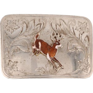 May include: Silver belt buckle with an engraved design of a deer running through a field of flowers.
