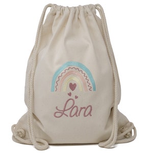 Drawstring bag embroidered with name and rainbow motif