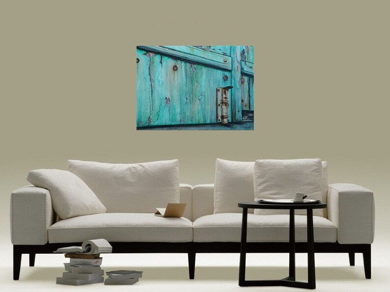 May include: A close-up of a weathered turquoise wooden door with a rusty metal hinge. The door is slightly ajar, revealing a glimpse of the interior.