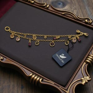 Swarovski Gold Tone Double Chain Bracelet • Multicolor Crystal Drops • Open Bezel • 7.5" Length • Brand New with Tags