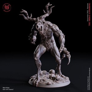 May include: A detailed, grey, 3D printed miniature of a Wendigo, a mythical creature with antlers, a snarling face, and claws. The miniature is standing on a circular base with skulls scattered around it. The text "Wendigo (50 mm base)" is printed below the miniature.