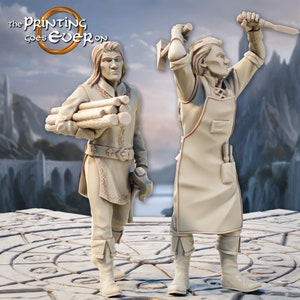 May include: Two unpainted figurines of people, one holding a bundle of wood and the other holding a hammer and a knife. The figurines are standing on a circular platform with a pattern of concentric circles.