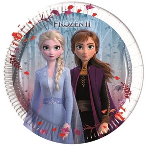 May include: Two Disney Frozen II characters, Elsa and Anna, are featured on a round paper plate. Elsa is wearing a light blue dress with a white belt and a long blonde braid. Anna is wearing a purple and brown dress with a long brown braid. The background is a blue and white forest scene with red leaves.