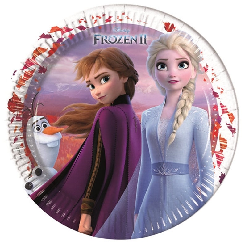 May include: Round paper plates featuring Disney's Frozen II. The plates are white with a red, orange, and yellow fall leaf pattern around the edge. The center of the plate features a scene from the movie with Elsa, Anna, and Olaf. The text "Disney Frozen II" is printed in black at the top of the plate.