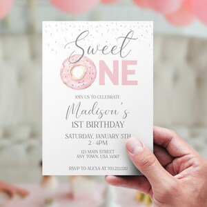 May include: Pink and white donut-themed first birthday party invitation with the text "Sweet One" and "Madison's 1st Birthday". The invitation includes the date, time, address, and RSVP information.