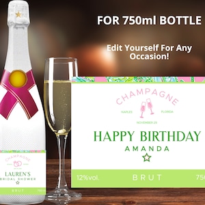 May include: A champagne bottle label with a pink ribbon and a star. The label says "Lauren's Bridal Shower" and "BRUT". The label is for a 750 ml bottle. The label is also customizable for any occasion.