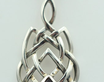 May include: A silver pendant with a Celtic knot design and a purple amethyst gemstone.