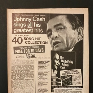 May include: A vintage magazine ad for a 40-song collection of Johnny Cash's greatest hits. The ad features a photo of Johnny Cash and a description of the collection, which includes songs like "Folsom Prison Blues", "Ring of Fire", and "A Boy Named Sue".