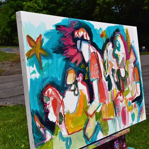 May include: Abstract painting on canvas with bright colors, including turquoise, pink, yellow, and orange. The painting features several figures and a star shape.