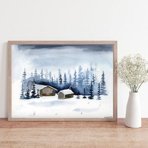 May include: A watercolor painting of two small houses in a snowy forest. The houses are brown and the trees are blue. The sky is a light blue with white clouds.