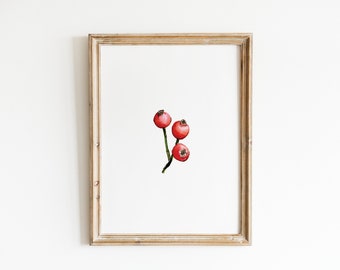 May include: A framed watercolour painting of three red berries on a green stem.