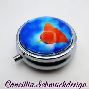 scatola per pillole papavero rosso blu tre scomparti