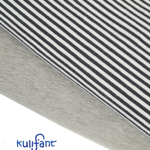 May include: Two folded pieces of fabric stacked together. The top layer features a pattern of thin black and white vertical stripes. The bottom layer is a solid heather grey colour. The blue text kulifant is printed in the bottom left corner.