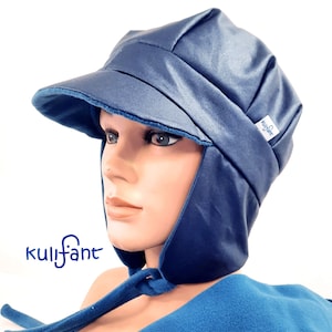 May include: A navy blue hat with a peak and ear flaps. The hat is made of a shiny material and has a soft, blue lining. The hat is on a mannequin head. The brand name "kulifant" is visible on the hat.