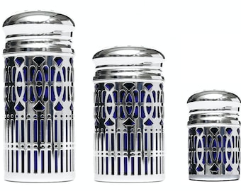 Silver-plated salt and pepper shaker set for the dining table. Silver spice shakers for pepper and salt with blue inserts.