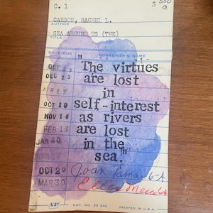 May include: A vintage library card with text and watercolour accents. The card features the title "Sea Around Us" and a quote: "The virtues are lost in self-interest as rivers are lost in the sea." The card is printed in the U.S.A.
